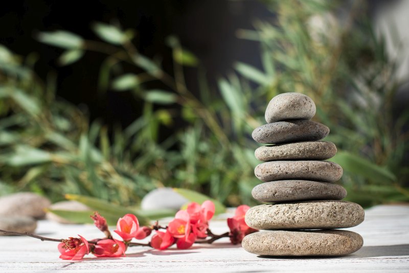 A comparison of two scales—one balancing on a thin, fragile needle (self-esteem) and one rooted deeply in the ground (self-worth).