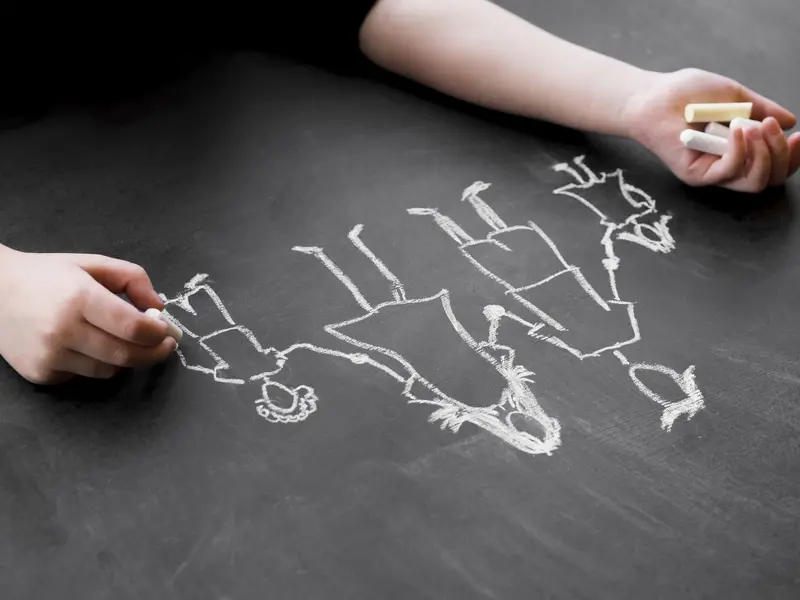 A child sketching a life plan on a giant blueprint of a human brain, representing Eric Berne's Life Scripts and neuroplasticity.